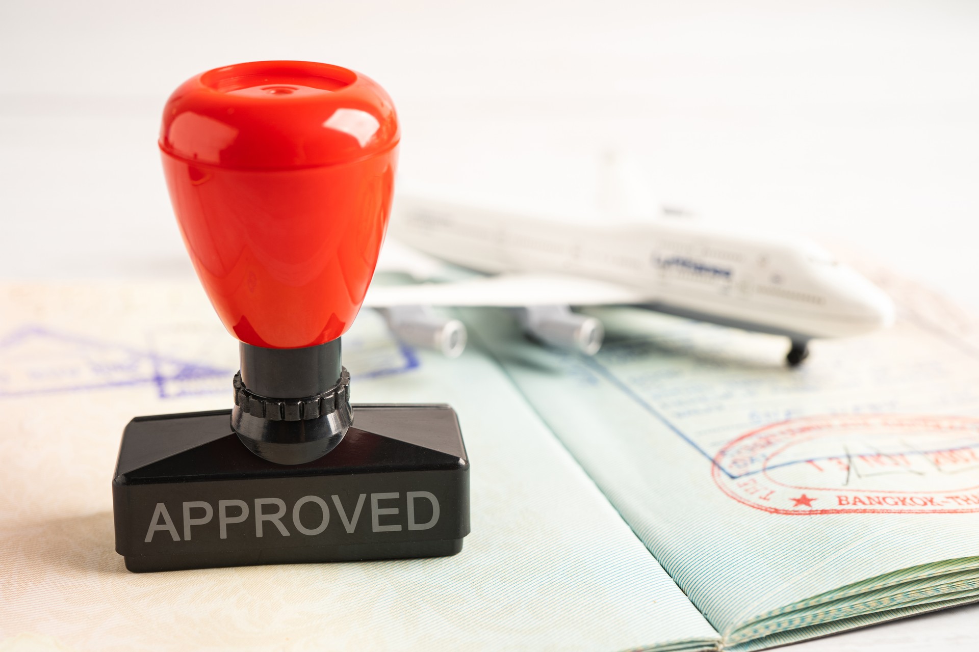 Approved Stamp visa and passport document to immigration at airport in country.